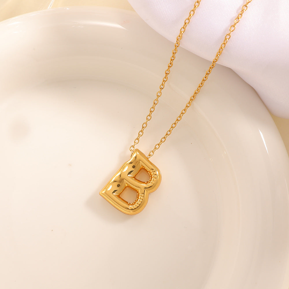 Women's necklace with curved letter pendant Hapa Style