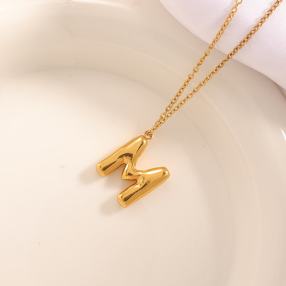 Women's necklace with curved letter pendant Hapa Style