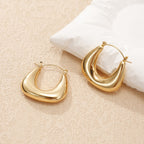 Ladies earrings in a modern, curved design Hapa Style