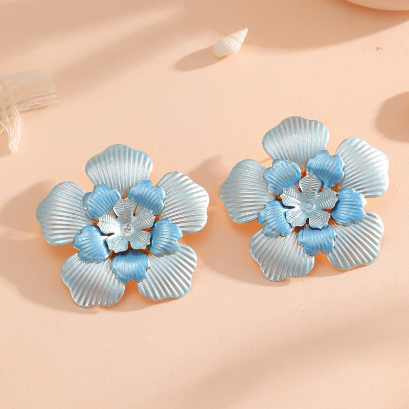 Ladies' flower earrings with intricate design and glossy accents Hapa Style