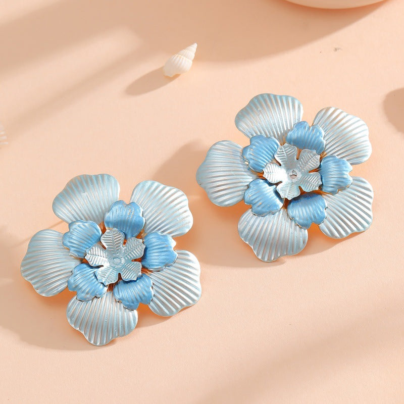 Ladies' flower earrings with intricate design and glossy accents Hapa Style
