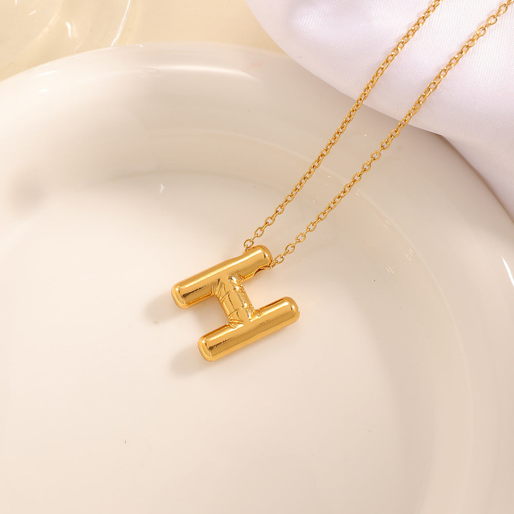 Women's necklace with curved letter pendant Hapa Style