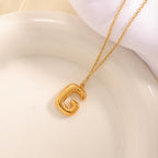 Women's necklace with curved letter pendant Hapa Style