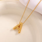 Women's necklace with curved letter pendant Hapa Style