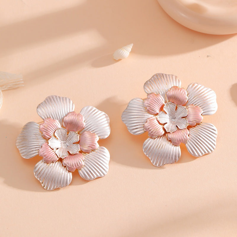 Ladies' flower earrings with intricate design and glossy accents Hapa Style