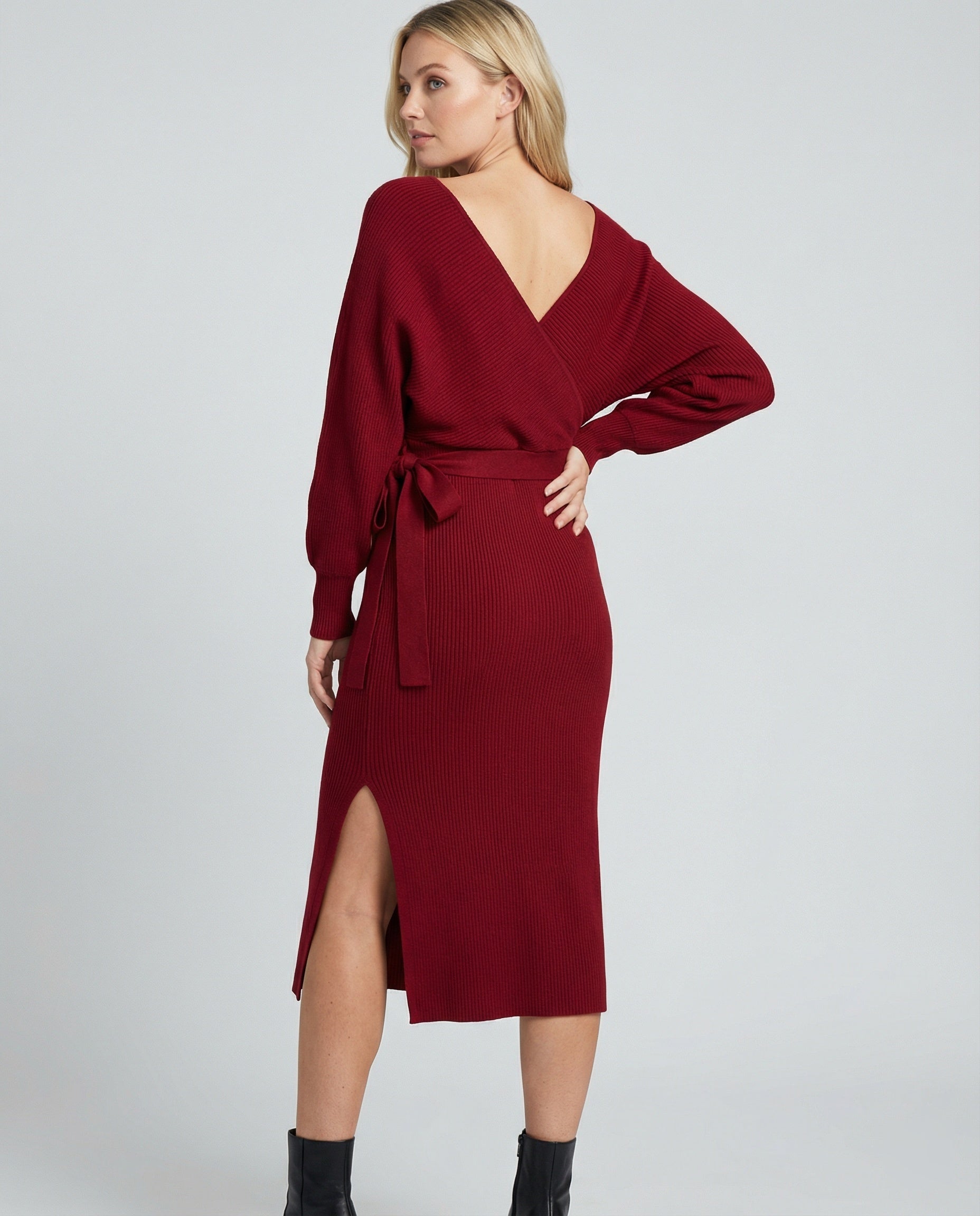 Ladies knit dress with elegant wrap design and decorative belt