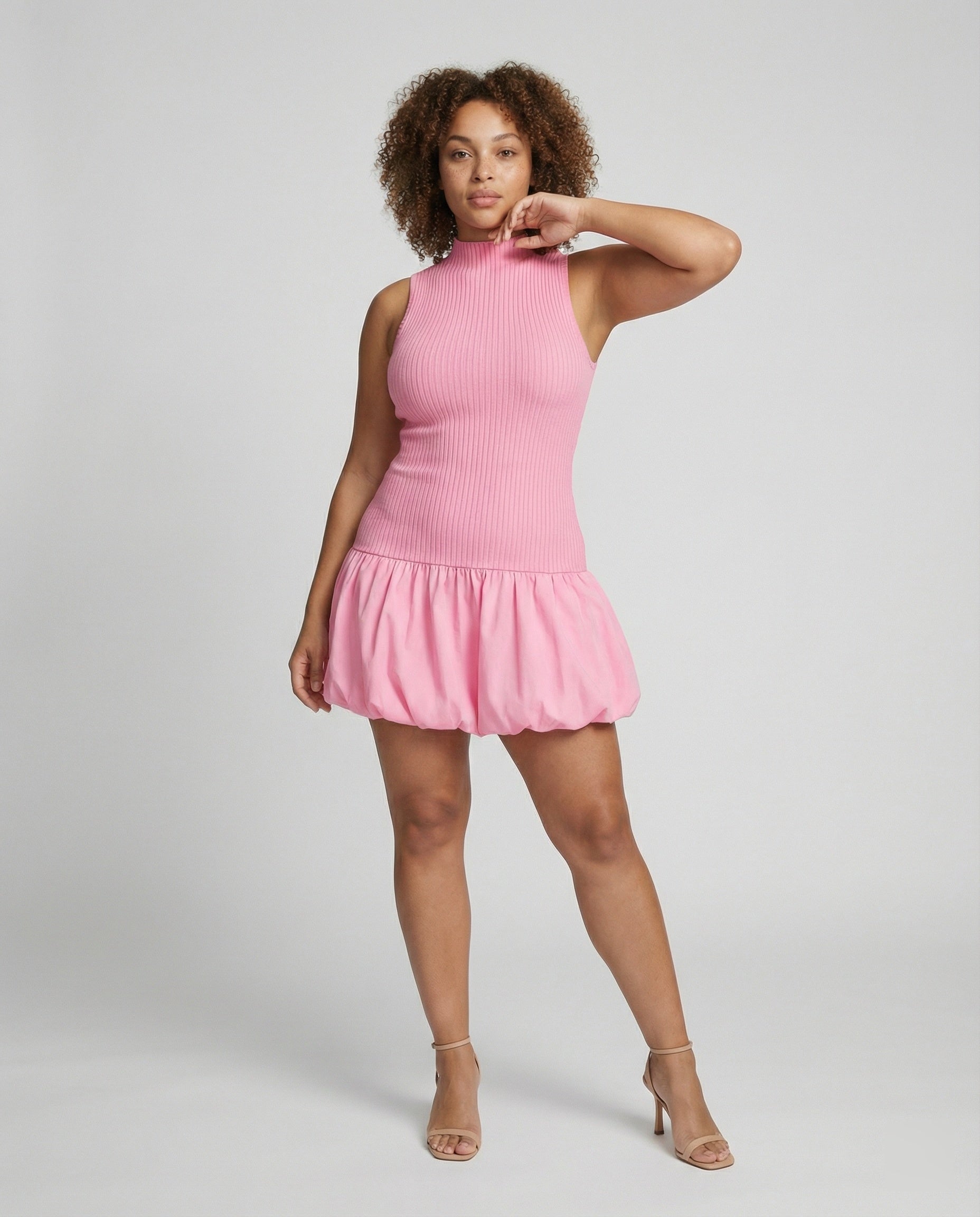 Women's dress with sleeveless, figure-hugging top and voluminous skirt