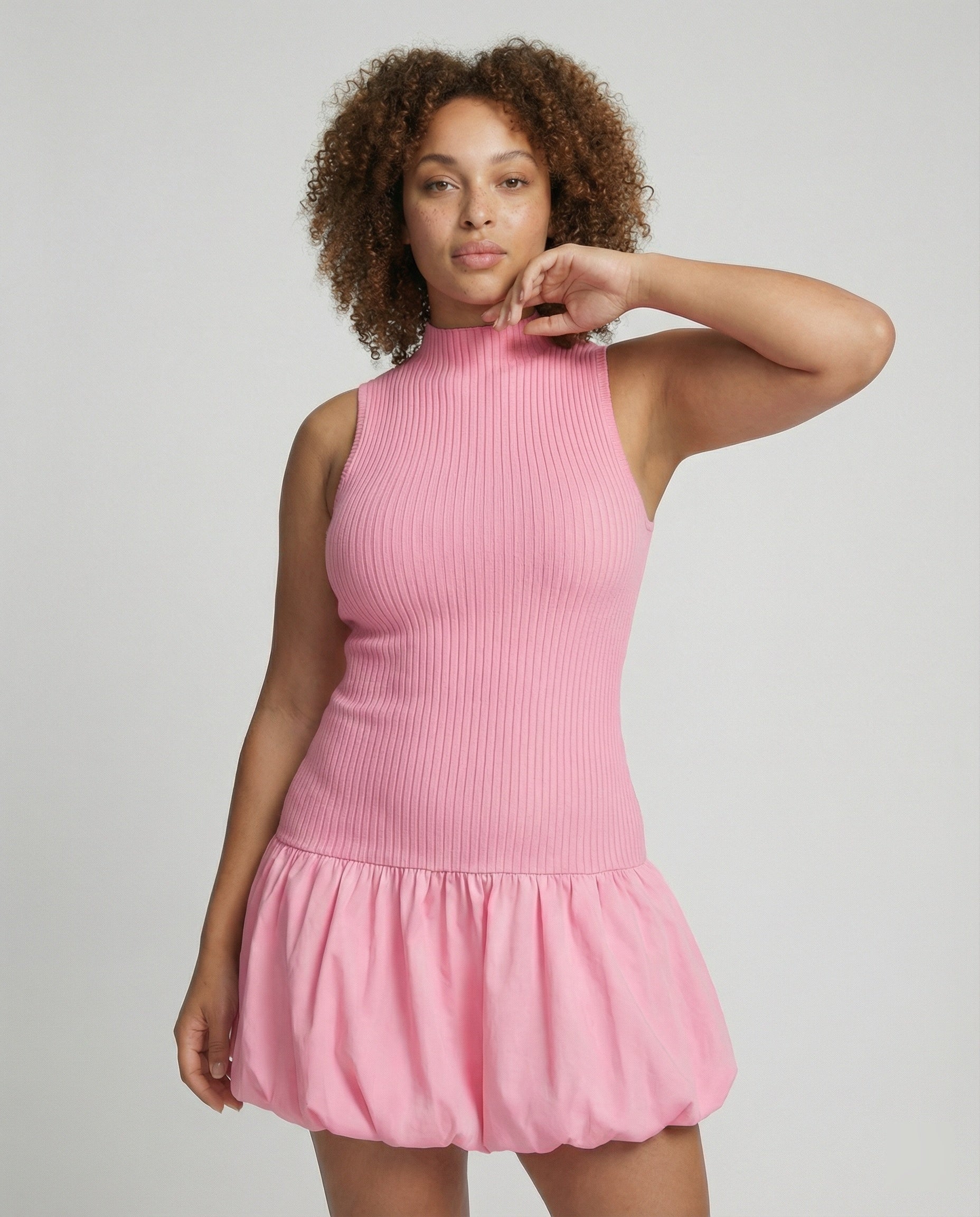 Women's dress with sleeveless, figure-hugging top and voluminous skirt