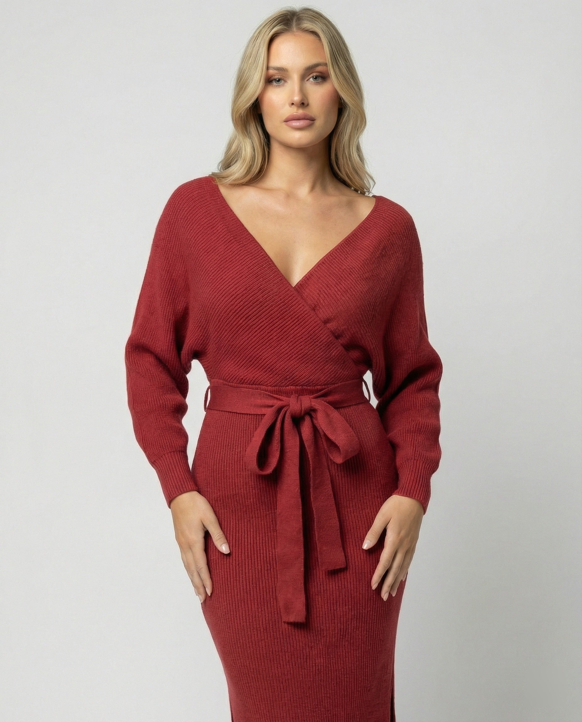Ladies knit dress with elegant wrap design and decorative belt