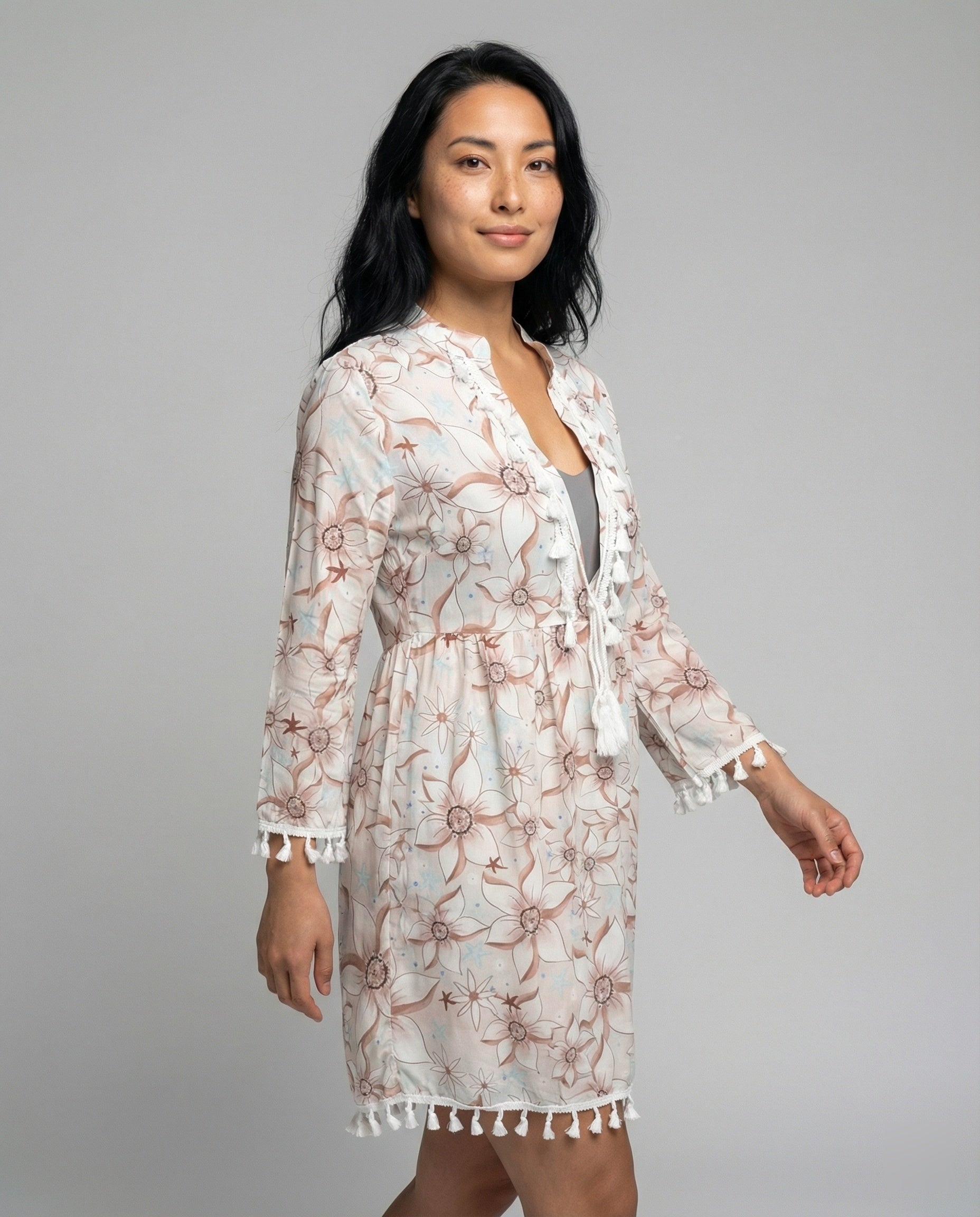Women’s beach dress with high collar and romantic floral pattern